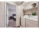 Functional laundry area with modern appliances and an adjacent bedroom view for easy access at 830 Carnegie St # 724, Henderson, NV 89052