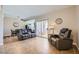 Inviting living area featuring comfortable seating and access to balcony with great light at 830 Carnegie St # 724, Henderson, NV 89052