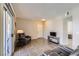 Comfortable living space with tile floors, a cozy armchair, and a sliding door at 830 Carnegie St # 724, Henderson, NV 89052