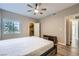 Inviting bedroom featuring a ceiling fan, abundant natural light, and a closet, creating a relaxing retreat at 830 Carnegie St # 724, Henderson, NV 89052