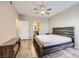 Well-lit bedroom with ceiling fan, closet, modern bed frame, and stylish furnishings for a relaxing space at 830 Carnegie St # 724, Henderson, NV 89052
