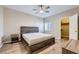 Comfortable bedroom boasting a ceiling fan, natural light, and a spacious closet for ample storage at 830 Carnegie St # 724, Henderson, NV 89052