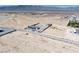 Aerial view of property with house, fenced lot and desert landscape and mountain view at 9090 Josepine St, Pahrump, NV 89048