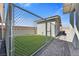 Fenced backyard featuring a block wall and turf at 9090 Josepine St, Pahrump, NV 89048