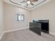 This bedroom offers great natural light, a modern ceiling fan and two tvs at 9090 Josepine St, Pahrump, NV 89048