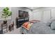 A bedroom with a flat screen TV, plant, and animal figurines at 9090 Josepine St, Pahrump, NV 89048