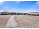 Long shot of a single-story house with multiple outbuildings at 9090 Josepine St, Pahrump, NV 89048