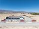 Gated desert home with a well-maintained yard and mountain views at 9090 Josepine St, Pahrump, NV 89048