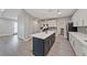 Open concept kitchen featuring a center island, stainless appliances, and plenty of natural light at 9090 Josepine St, Pahrump, NV 89048