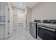 Laundry room featuring modern washer and dryer, plus extra storage at 9090 Josepine St, Pahrump, NV 89048