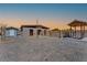 View of backyard buildings including a horse shelter, shed, and an awning at 9090 Josepine St, Pahrump, NV 89048