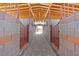 Interior view of horse stables with brick floors, and wood ceilings at 9090 Josepine St, Pahrump, NV 89048