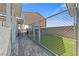 Backyard with artificial turf, shaded parking, block wall and pavers at 9090 Josepine St, Pahrump, NV 89048