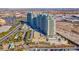 Scenic aerial view of luxury high-rise buildings, lush landscaping, palm trees, and a vibrant cityscape at 9101 Alta Dr # 18, Las Vegas, NV 89145