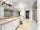 A luxurious bathroom featuring dual sinks, a large mirror, and a walk in closet at 9101 Alta Dr # 18, Las Vegas, NV 89145