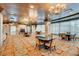 Elegant dining area with multiple tables, comfortable seating, and natural light, ideal for social gatherings at 9101 Alta Dr # 18, Las Vegas, NV 89145