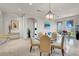 Airy dining area featuring a glass table, seating for four, and access to the outdoor living space at 9101 Alta Dr # 18, Las Vegas, NV 89145