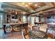 Spacious game room with custom bar, billiard table, and ample seating, perfect for entertaining guests and Gathering at 9101 Alta Dr # 18, Las Vegas, NV 89145
