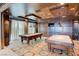 Spacious game room featuring two pool tables, custom wood paneling, and ample seating for entertainment at 9101 Alta Dr # 18, Las Vegas, NV 89145