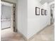 Hallway with decorative art and trim, leading to the laundry room, designed for visual appeal and seamless transition at 9101 Alta Dr # 18, Las Vegas, NV 89145