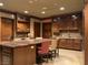 Gourmet kitchen boasts custom cabinetry, a marble island with seating, and modern stainless steel appliances at 9101 Alta Dr # 18, Las Vegas, NV 89145