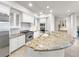 Bright kitchen with granite counter tops, stainless steel appliances, and white cabinets at 9101 Alta Dr # 18, Las Vegas, NV 89145