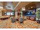 Comfortable lounge area with plush seating, stylish decor, and a large flat-screen TV, perfect for relaxation at 9101 Alta Dr # 18, Las Vegas, NV 89145