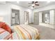 Bright bedroom featuring carpet, recessed lights, and access to the laundry room and bathroom at 9101 Alta Dr # 18, Las Vegas, NV 89145
