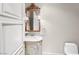 Elegant powder room with marble countertop and decorative mirror at 9101 Alta Dr # 18, Las Vegas, NV 89145