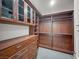 This is a large wooden walk-in closet with shelving and drawer space at 9101 Alta Dr # 18, Las Vegas, NV 89145
