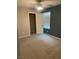 A bedroom featuring neutral carpet and paint, a ceiling fan, closet and a window with blinds at 9343 Sully Ave, Las Vegas, NV 89149