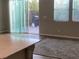 Living room featuring a sliding glass door to the backyard patio at 9343 Sully Ave, Las Vegas, NV 89149