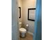 A powder room featuring updated fixtures, toilet and luxury vinyl plank flooring at 9343 Sully Ave, Las Vegas, NV 89149