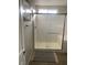 This is a modern stand-up shower with a glass enclosure, tile surround and a bench seat at 9343 Sully Ave, Las Vegas, NV 89149