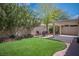 Backyard area featuring a pergola, artificial turf, and desert landscaping at 9446 Baltinglass St, Las Vegas, NV 89123