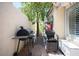 Side yard with BBQ grill, seat, and storage at 9446 Baltinglass St, Las Vegas, NV 89123