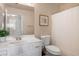 Cozy bathroom shows white vanity and tile and a shower with a curtain at 9446 Baltinglass St, Las Vegas, NV 89123