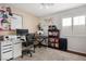 Bright bedroom with a computer desk, keyboard, bookshelf and decor at 9446 Baltinglass St, Las Vegas, NV 89123