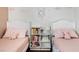 Charming pink bedroom showcasing twin beds with matching decor at 9446 Baltinglass St, Las Vegas, NV 89123
