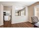 Dining area featuring hardwood floors and natural light from the large window at 9446 Baltinglass St, Las Vegas, NV 89123