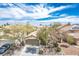 Inviting single-story home with desert landscaping and a two-car garage under a beautiful partly cloudy blue sky at 9446 Baltinglass St, Las Vegas, NV 89123
