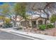 Traditional home with mature trees and a well-kept front yard at 9446 Baltinglass St, Las Vegas, NV 89123