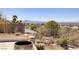 Tranquil backyard featuring desert landscaping and panoramic mountain views at 979 Evening Dew Dr, Las Vegas, NV 89110