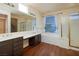 Bright bathroom with dual sinks, soaking tub, and separate shower offers relaxation at 979 Evening Dew Dr, Las Vegas, NV 89110