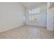 Spacious bedroom with tile floors, ample natural light, and high ceilings at 979 Evening Dew Dr, Las Vegas, NV 89110