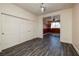 Bedroom featuring wood-look floors, large closet, and inviting natural light at 979 Evening Dew Dr, Las Vegas, NV 89110
