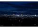 Expansive city view showcasing the bright lights of the strip at night and distant mountains at 979 Evening Dew Dr, Las Vegas, NV 89110