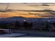 Breathtaking Las Vegas city view at sunset from a property featuring a skyline and mountain backdrop at 979 Evening Dew Dr, Las Vegas, NV 89110