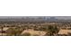 Distant shot of a large city featuring homes, businesses, landscaping, and a desert landscape at 979 Evening Dew Dr, Las Vegas, NV 89110