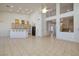 Open-concept living space with adjacent kitchen, offering seamless flow and functionality at 979 Evening Dew Dr, Las Vegas, NV 89110